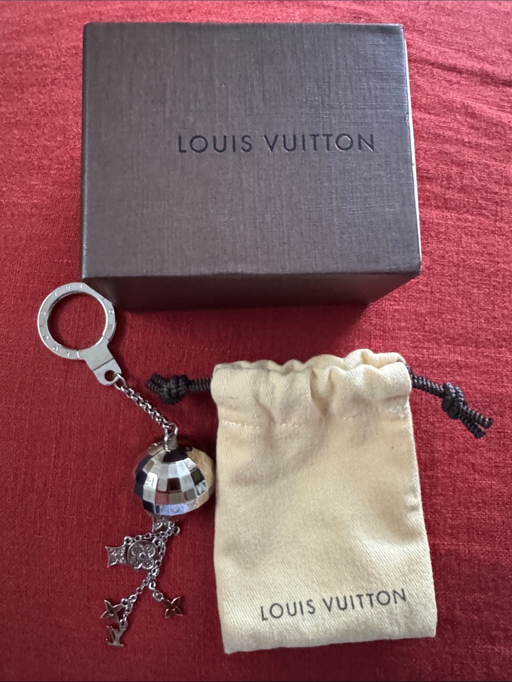 NWOT Louis Vuitton Silver Mirror Ball Keychain with Cream Dust Bag and Box